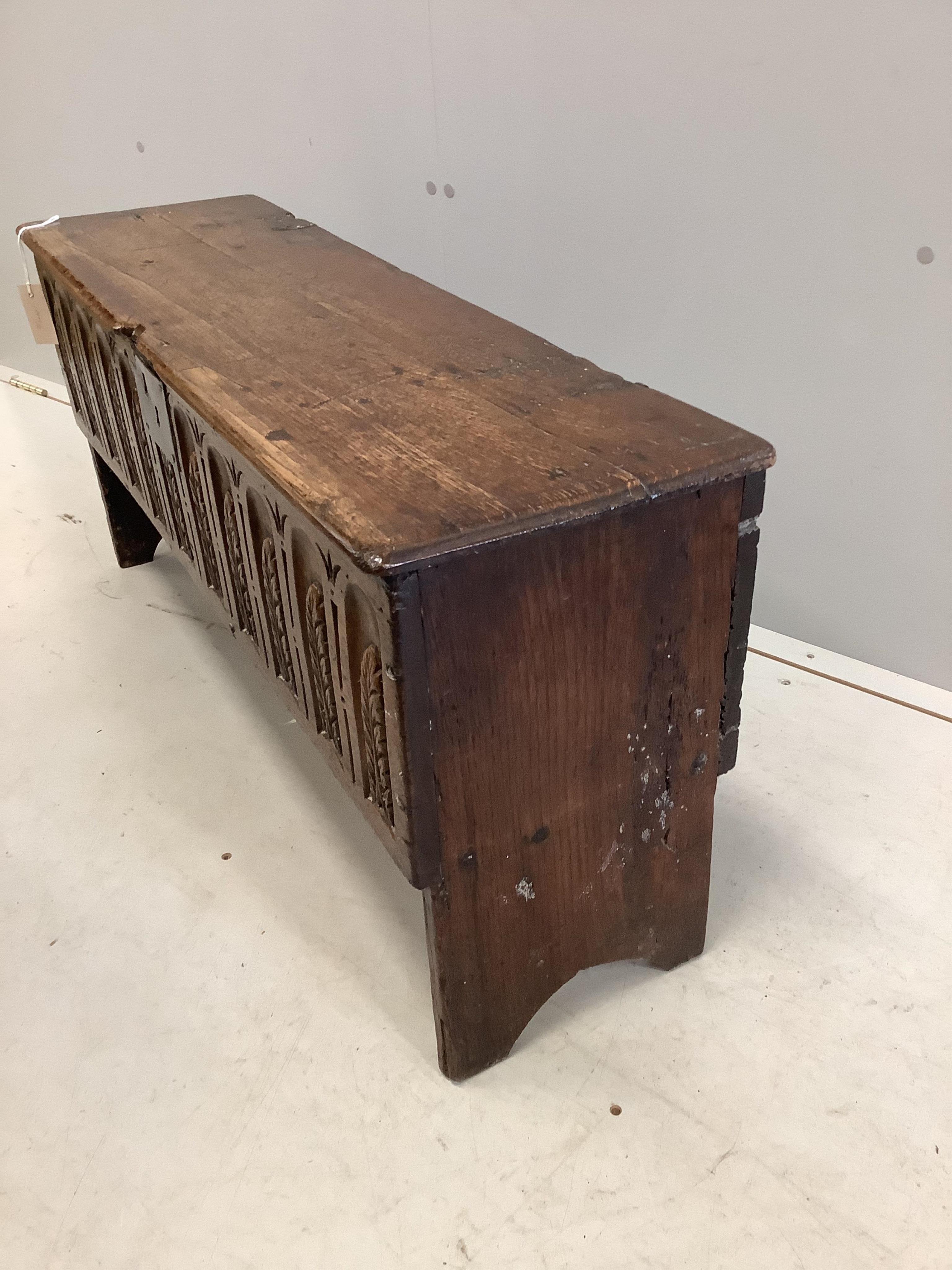 A late 17th century style carved oak six plank coffer, width 96cm, depth 29cm, height 45cm. Condition - fair